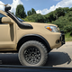 Illustration for article titled Check Out This Militarized Toyota Hilux and Its Weird Door Handles